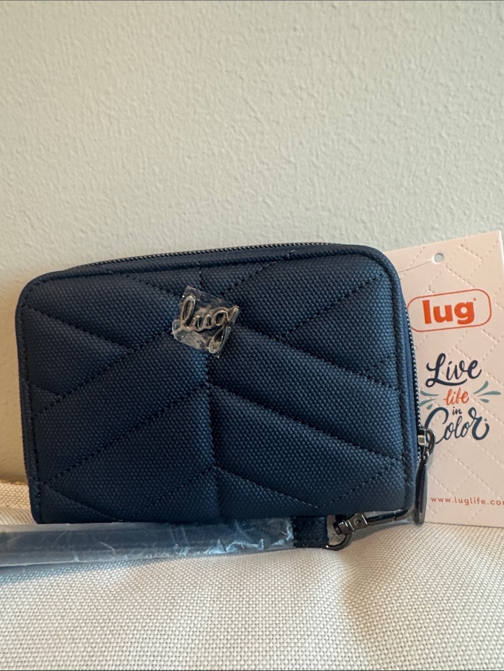 Lug matte luxe Indigo Rodeo compact wallet with matching wristlet.